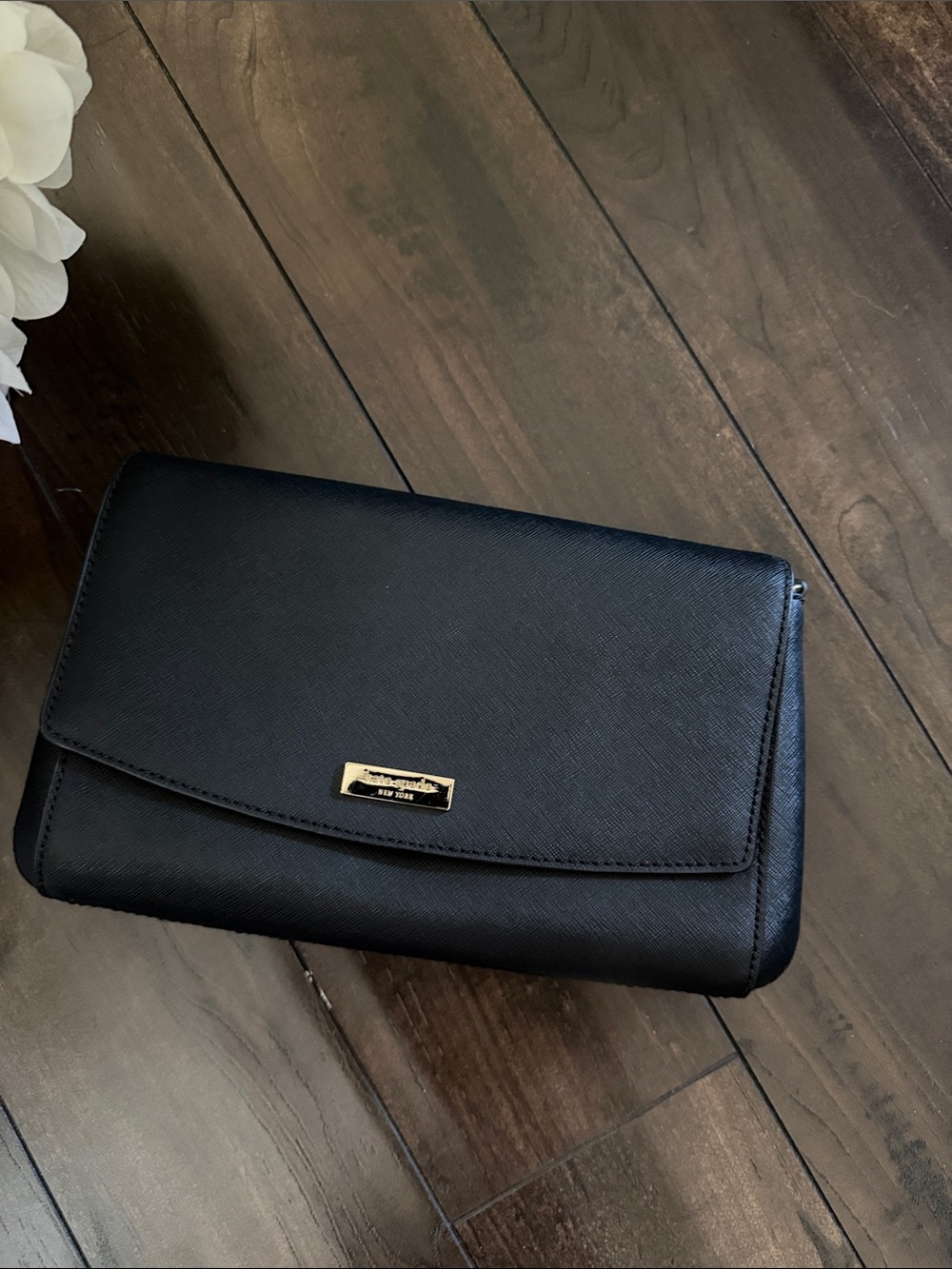 kate spade black leather flap wristlet with gold plaque